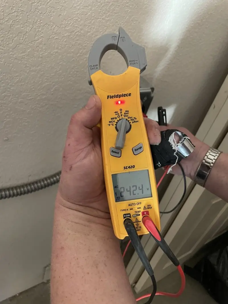 Voltage testing with clamp meter during Generator Installation in Valinda